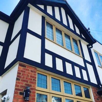 tudor board cladding|cost to replace tudor boards.